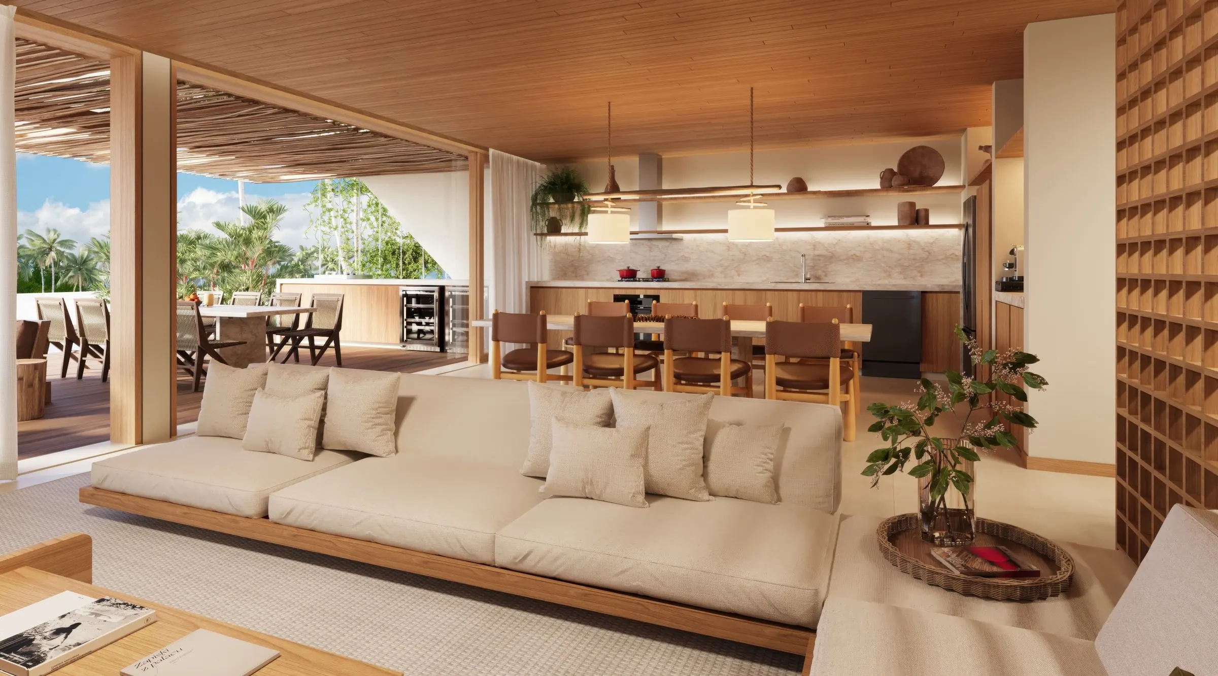 An open plan living room and kitchen with a sea view