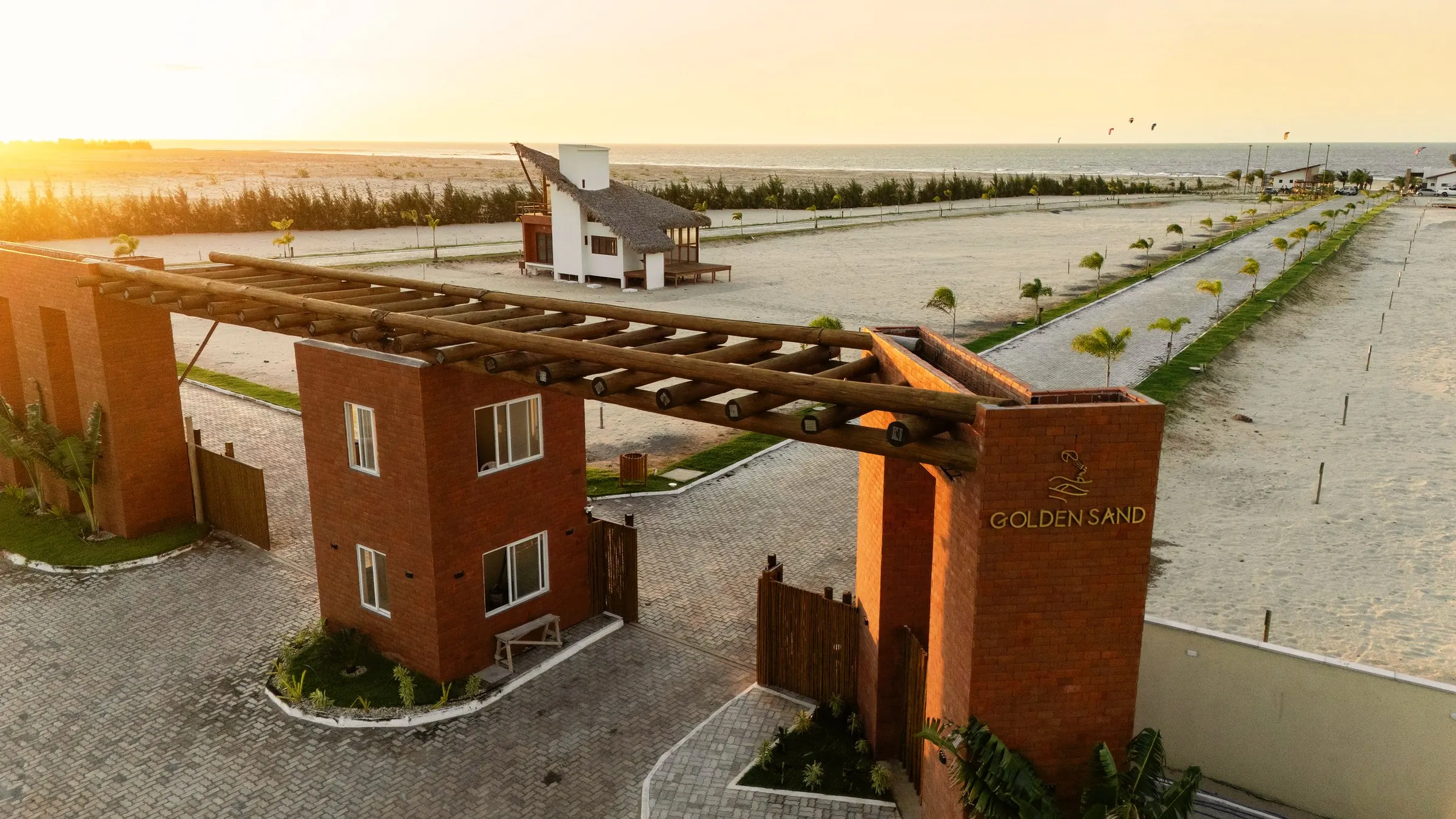 Aerial view of the entrance and beach club at sunset